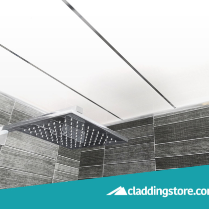 PROPANEL® Single Inlay Chrome 8mm installed to a ceiling in showroom alongside a grey tile effect cladded bathroom wall.